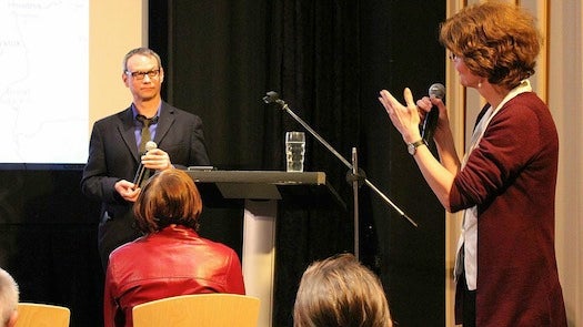 Dr. Eigler with one of the symposium speakers on stage