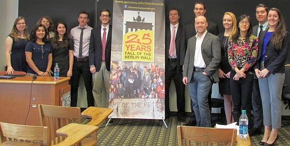 German Department students with a banner celebrating the 25th anniverary of the fall of the Berlin Wall