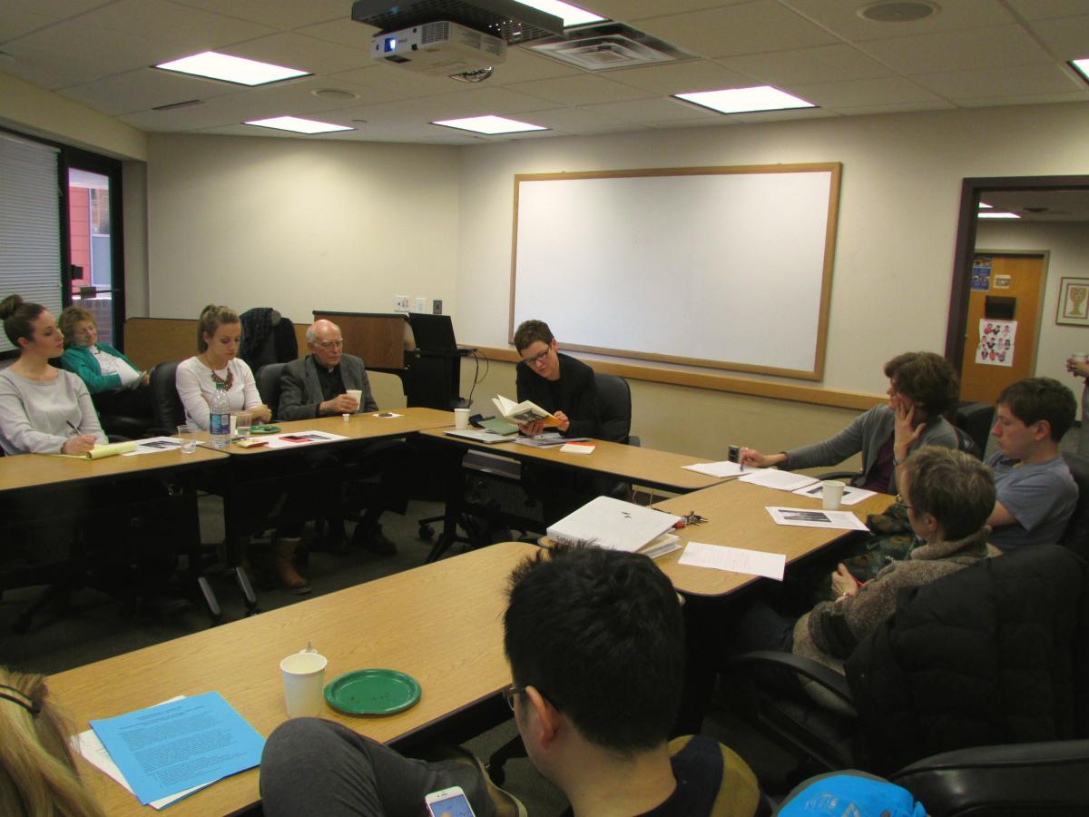 Maxi Obexer with German Department faculty and graduate students sitting around a large table during a discussion