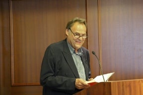 Dr. Peter Schneider at the podium during his reading