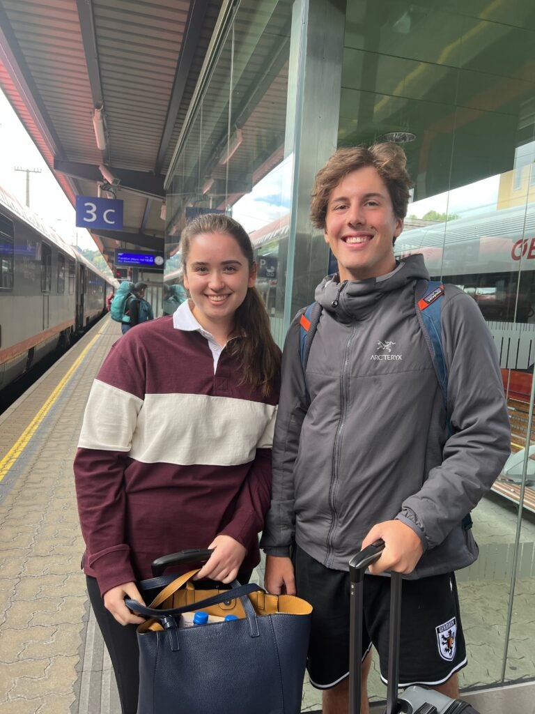 Helen Poe and Ben Gaver standing on the platform at the train station in Kärnten, Austria. 