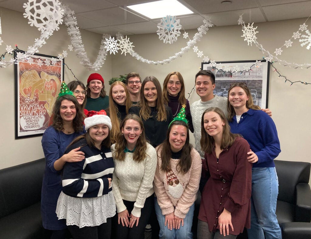 Visiting Researcher Sandra Schell (center) with German Department graduate students during the 2024 Holiday Party