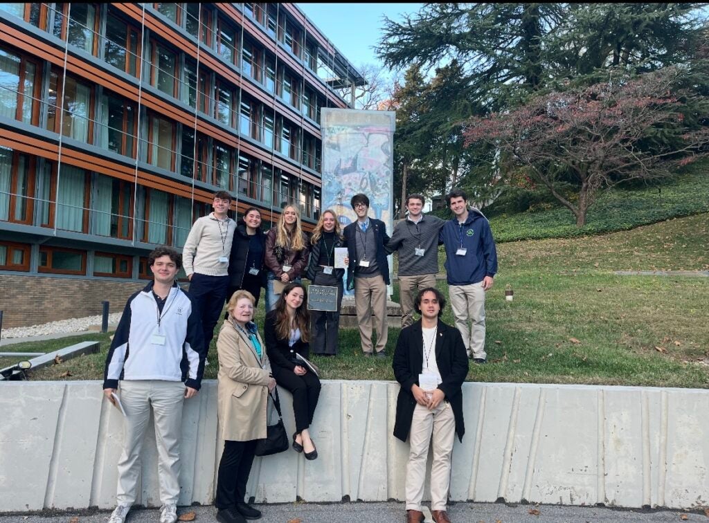 Members of the German Club stand outside the German Embassy in Washington, DC