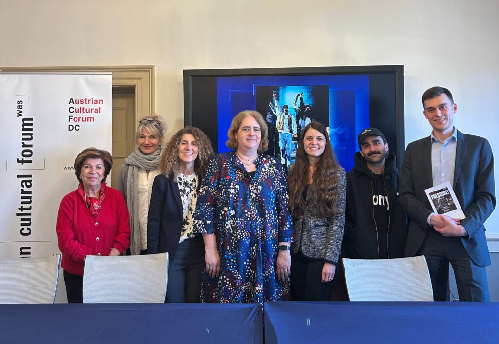 Author Arad Dabiri stands with members of the Austrian Cultural Forum, Georgetown University, and the ExPats theatre