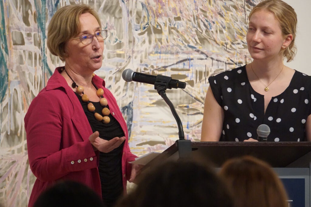 Professor Weigert and Madeleine Ott stand at the podium during the Great Women Writers event