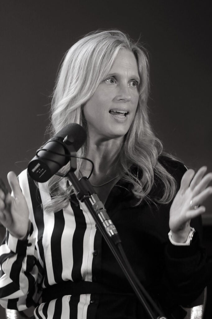 Dr. Nicola Gess speaks into a microphone